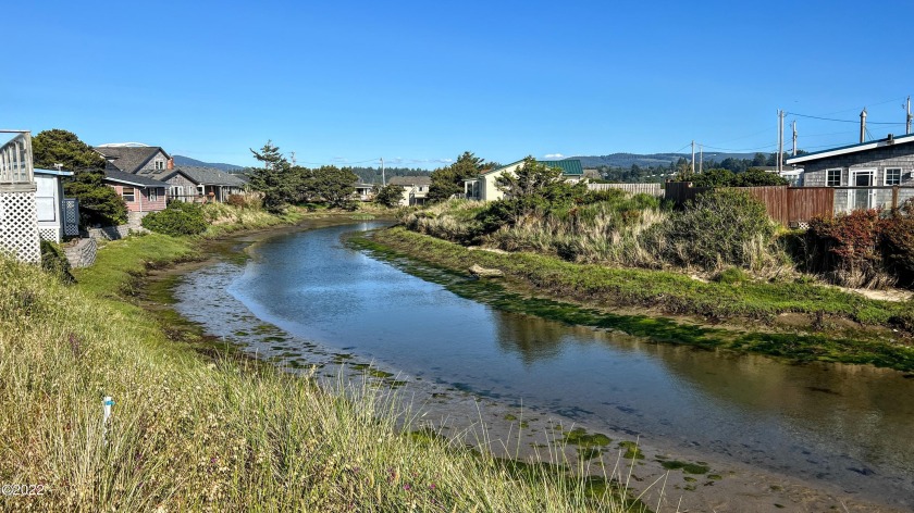 Flat buildable .14-acre Canal Front lot located west side with - Beach Lot for sale in Waldport, Oregon on Beachhouse.com