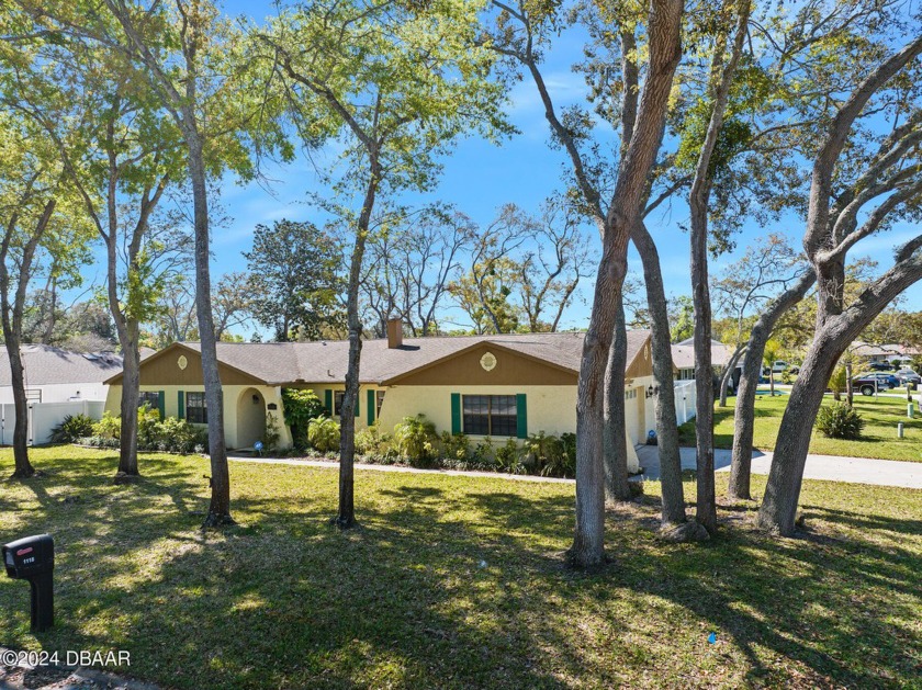 Lovely 4 bedroom solid block home shaded by lovely mature - Beach Home for sale in Ormond Beach, Florida on Beachhouse.com