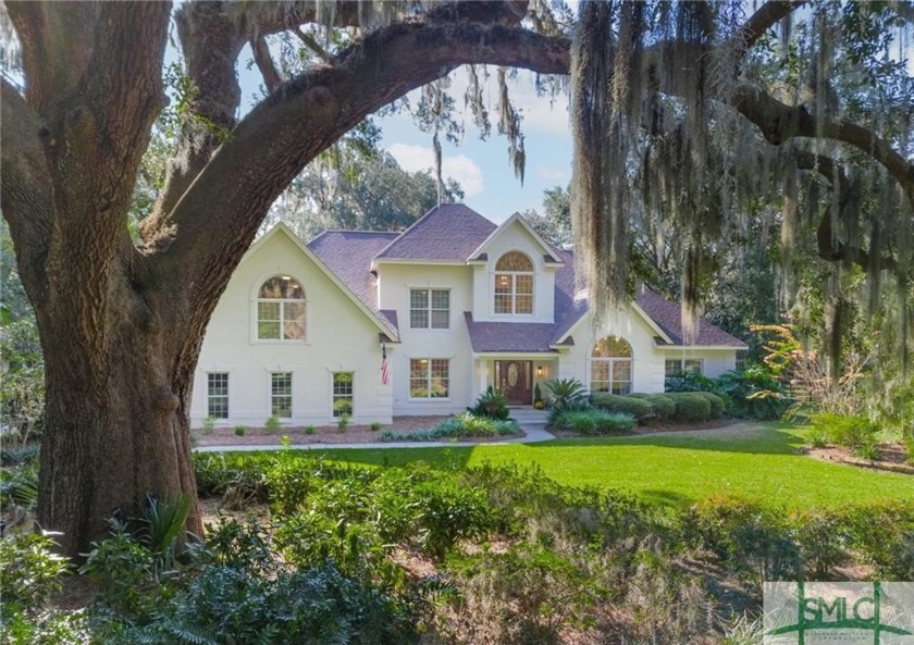 Nestled on a serene 1.8-acre private wooded homesite situated - Beach Home for sale in Richmond Hill, Georgia on Beachhouse.com