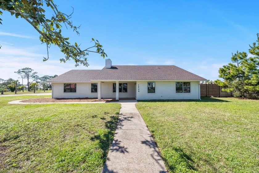 This inviting four-bedroom, three-bathroom home sits on a large - Beach Home for sale in Port St Joe, Florida on Beachhouse.com