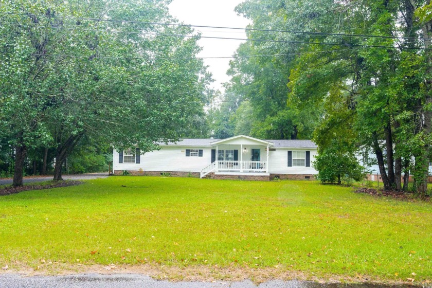 This 3 bedroom, 2 full bath mobile home is located on .90 acres - Beach Home for sale in Georgetown, South Carolina on Beachhouse.com