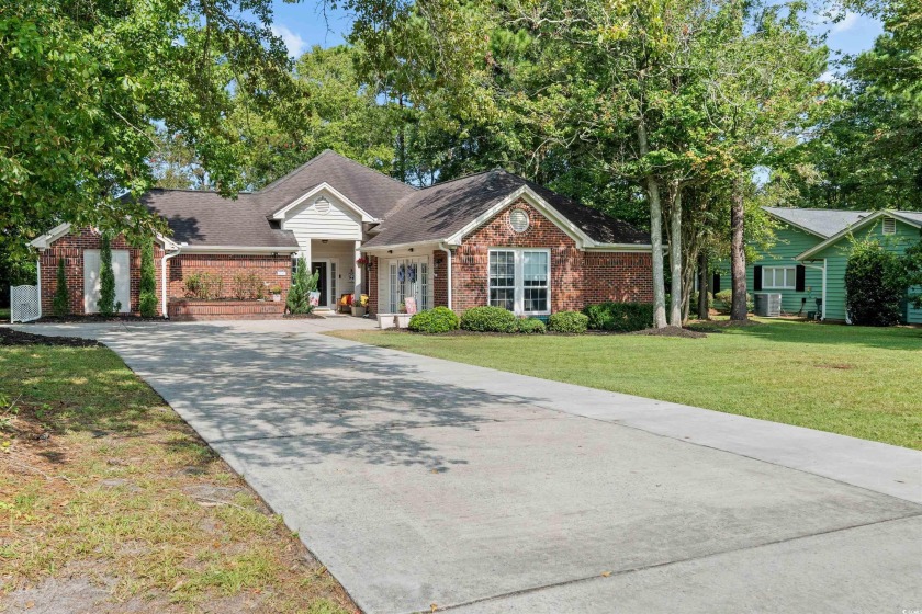 Beautiful red brick home in Deerfield. This 3 bedroom 2 bath - Beach Home for sale in Surfside Beach, South Carolina on Beachhouse.com