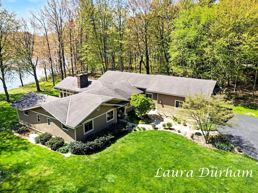 Nestled along the peaceful shores of Goshorn Lake, this - Beach Home for sale in Saugatuck, Michigan on Beachhouse.com