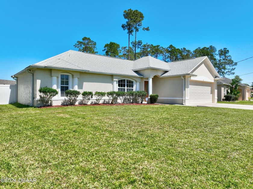 This centrally located home offers close proximity to Elementary - Beach Home for sale in Palm Coast, Florida on Beachhouse.com