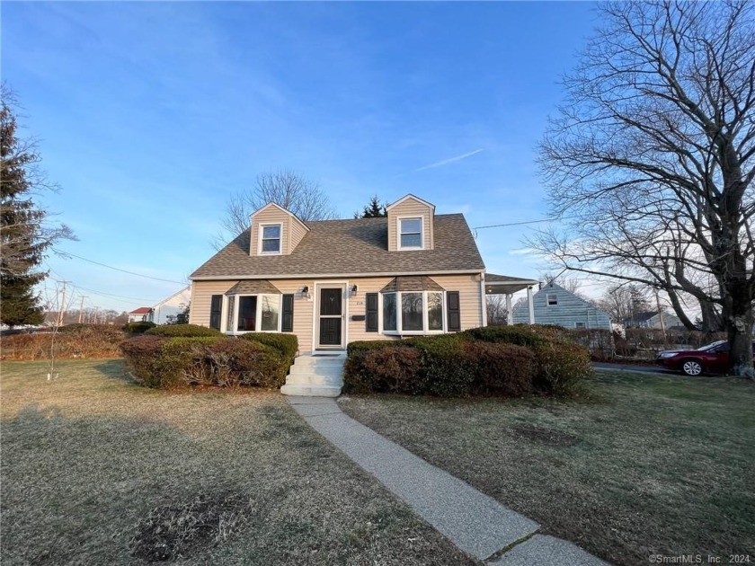 Welcome to this charming two-bedroom residence, ideally situated - Beach Home for sale in Milford, Connecticut on Beachhouse.com