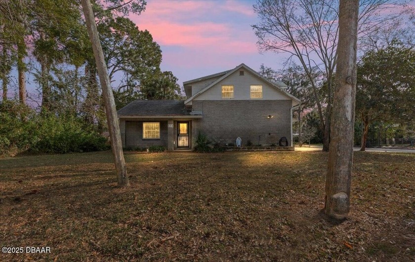 Welcome to this well-built two-story brick home located in the - Beach Home for sale in Ormond Beach, Florida on Beachhouse.com