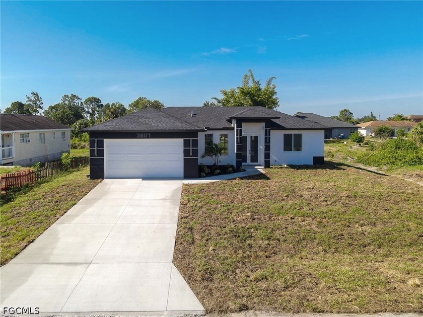 Experience the perfect blend of modern comfort and style in this - Beach Home for sale in Lehigh Acres, Florida on Beachhouse.com