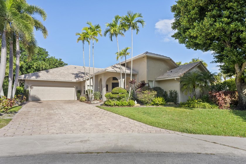 NESTLED AT THE END OF A PREMIER CUL DE SAC, THIS HOME OFFERS A - Beach Home for sale in Boca Raton, Florida on Beachhouse.com