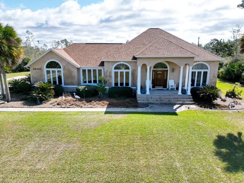 Nestled on 1.95 acres corner lot in a private setting, this - Beach Home for sale in Port St Joe, Florida on Beachhouse.com