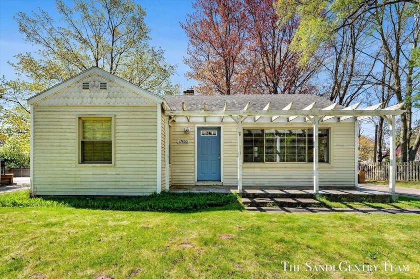 Welcome to 17300 W Spring Lake Rd, a charming, move-in ready - Beach Home for sale in Spring Lake, Michigan on Beachhouse.com