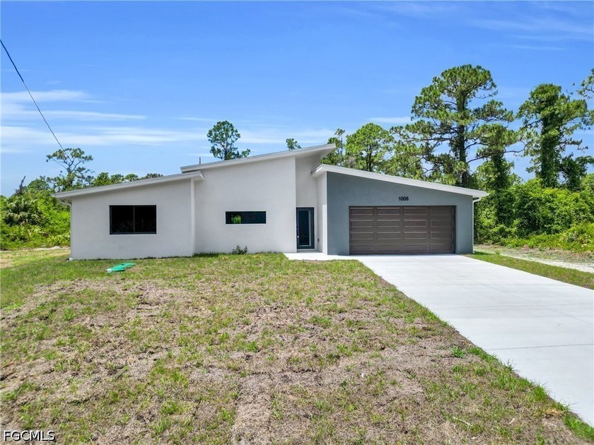 This unique modern house offers luxury at its best. Bright light - Beach Home for sale in Lehigh Acres, Florida on Beachhouse.com