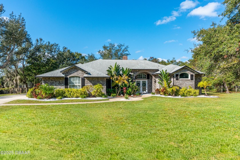 Welcome home! This stunning 4-bedroom, 3-bath POOL home sits on - Beach Home for sale in Port Orange, Florida on Beachhouse.com