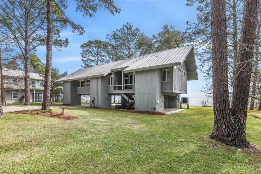 Step into a coastal dream at this exquisite waterfront retreat - Beach Home for sale in Lanark Village, Florida on Beachhouse.com