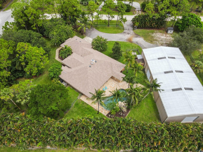 Welcome to this incredible single-family pool home with an - Beach Home for sale in West Palm Beach, Florida on Beachhouse.com