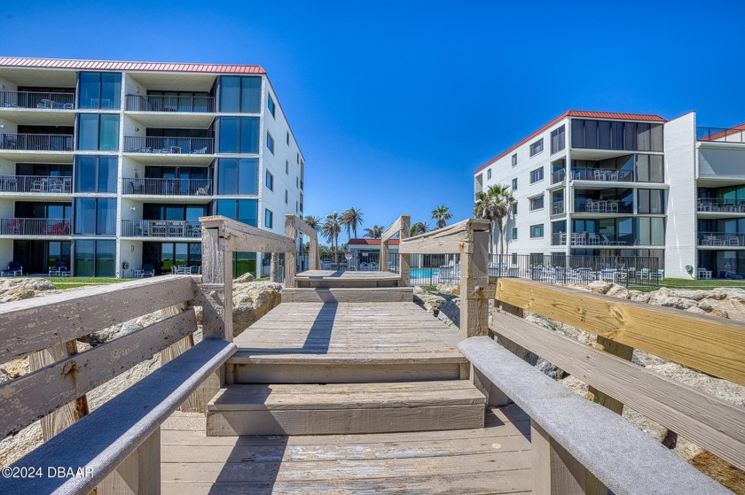 Experience floor to ceiling panoramic views of the ocean from - Beach Condo for sale in New Smyrna Beach, Florida on Beachhouse.com