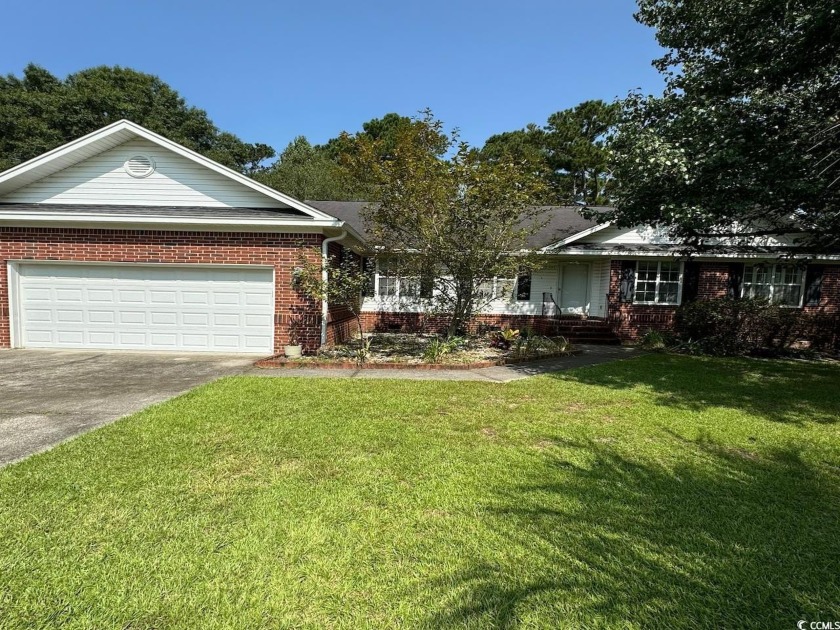 This two-bedroom three bath home is tucked away on a quiet - Beach Home for sale in Georgetown, South Carolina on Beachhouse.com