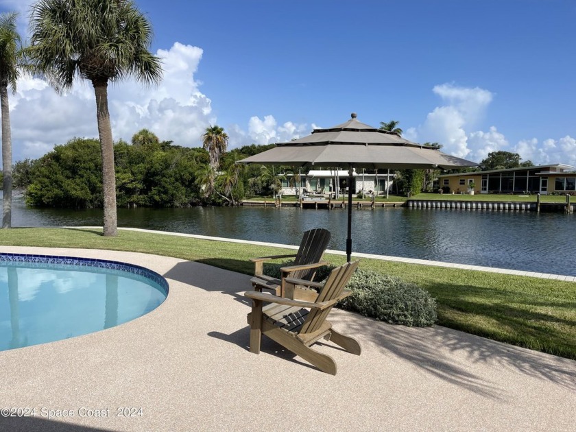 Capri Road is a truly picturesque Waterfront Pool Home in the - Beach Home for sale in Cocoa Beach, Florida on Beachhouse.com