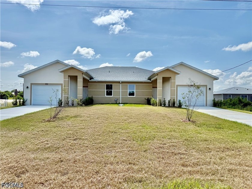BRAND NEW DUPLEX 6 BEDROOMS 4 BATHROOMS WITH EXTRA LONG CONCRETE - Beach Home for sale in Lehigh Acres, Florida on Beachhouse.com