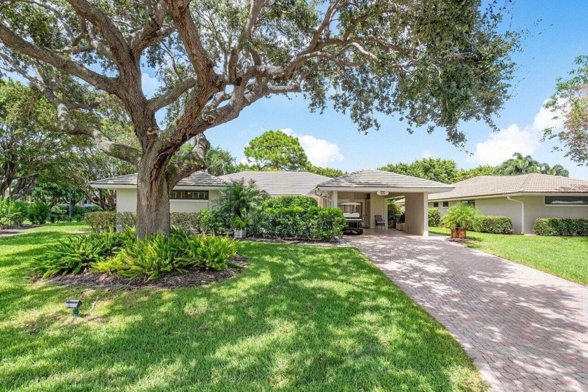 Welcome to your tranquil retreat featuring a captivating garden - Beach Home for sale in Boynton Beach, Florida on Beachhouse.com