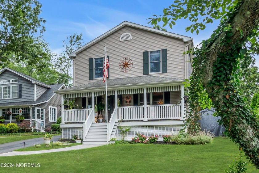 Perched on an elevated lot sitting back amongst mature trees is - Beach Home for sale in Spring Lake, New Jersey on Beachhouse.com