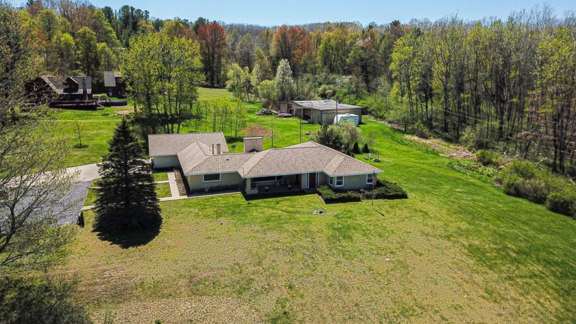 Scenic Portage Lake view with privacy! Brick ranch on 3.27 acres - Beach Home for sale in Onekama, Michigan on Beachhouse.com