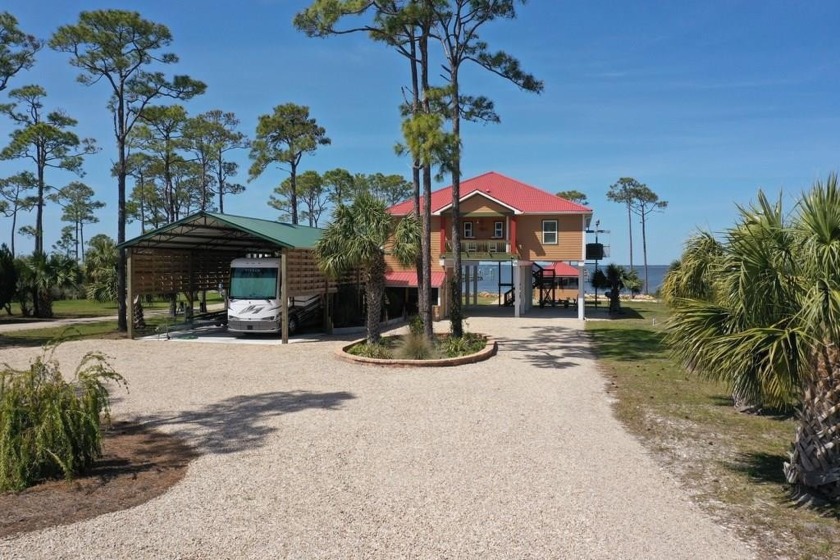 Meticulously maintained Bayfront home nestled privately on St - Beach Home for sale in St. George Island, Florida on Beachhouse.com