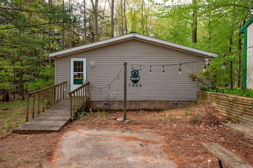 Set on 5 wooded lots near the north shore of Stony Lake in - Beach Home for sale in Shelby, Michigan on Beachhouse.com
