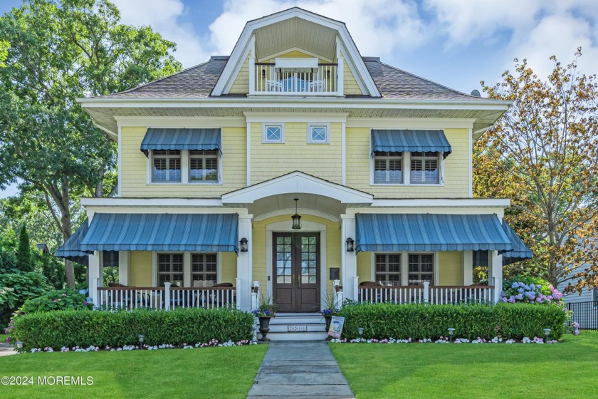 A relaxing mahogany porch surrounded by gorgeous perennial - Beach Home for sale in Spring Lake, New Jersey on Beachhouse.com