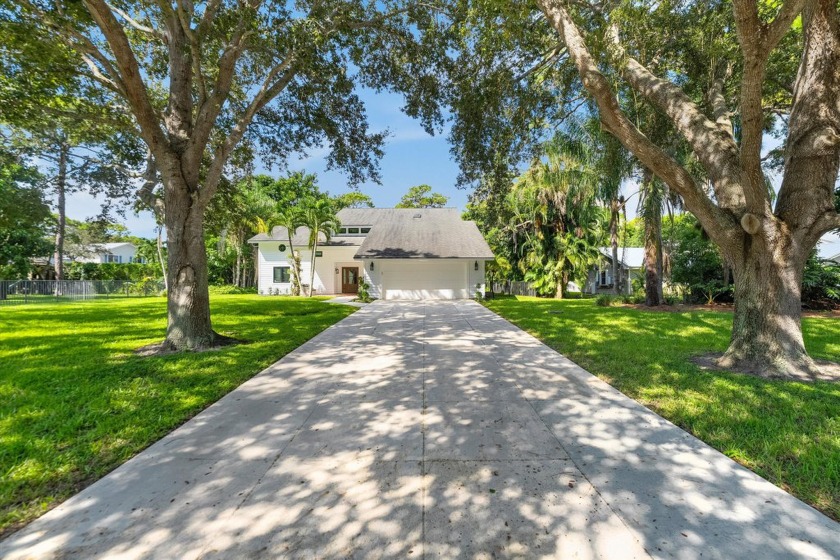 Stunning 4BD / 3BA pool home situated on a premium .53-acre - Beach Home for sale in Jupiter, Florida on Beachhouse.com