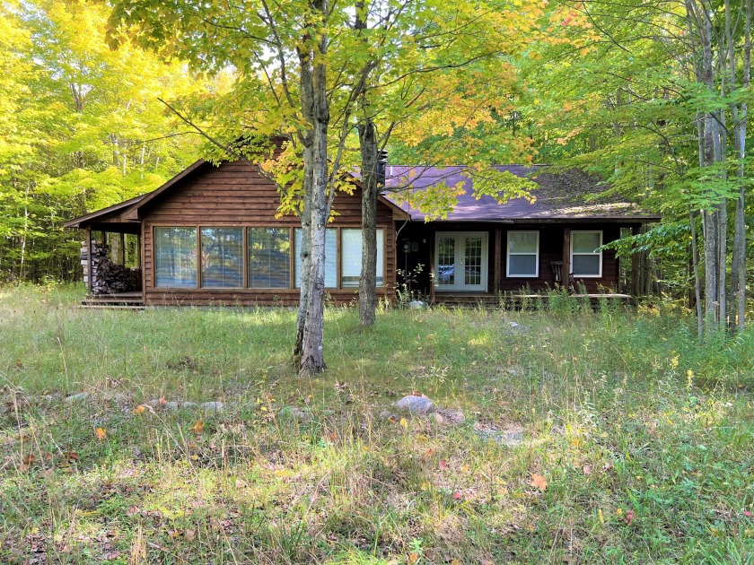 THIS IS NO ORDINARY HUNTING CAMP. 446 ACRES +/-, 2000 +/- FEET - Beach Home for sale in Cheboygan, Michigan on Beachhouse.com