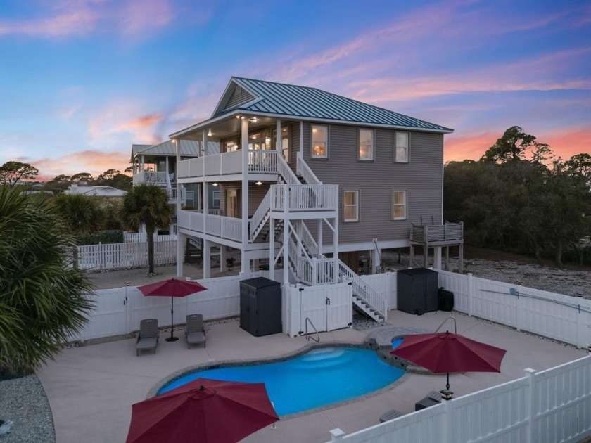 This beautifully maintained 4-bedroom, 4.5-bath home sits on a - Beach Home for sale in St. George Island, Florida on Beachhouse.com