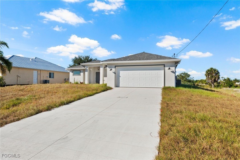 Step into this brand-new construction home in NW Cape Coral - Beach Home for sale in Cape Coral, Florida on Beachhouse.com