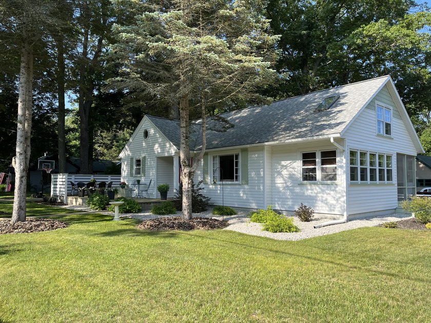 NOW SHOWING! Just in time for summer! This delightful home full - Beach Home for sale in Pentwater, Michigan on Beachhouse.com