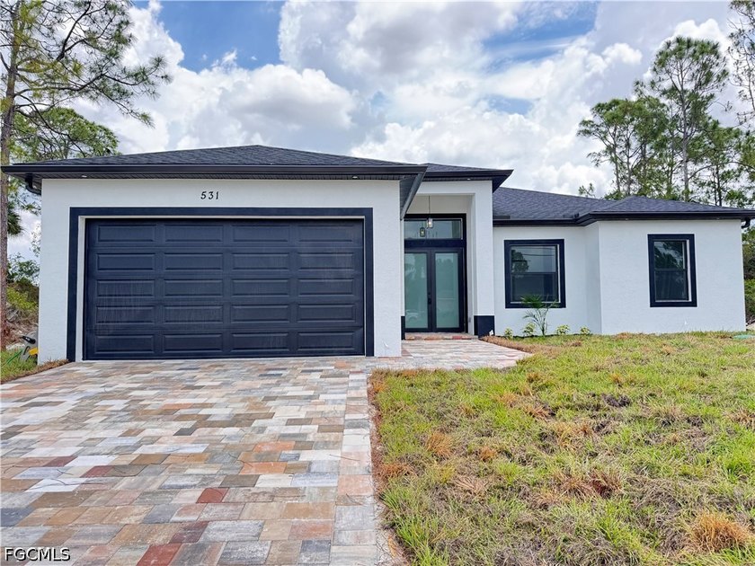 Discover this stunning brand-new home in the highly desirable - Beach Home for sale in Lehigh Acres, Florida on Beachhouse.com