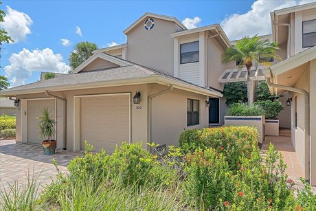 This totally renovated ground floor coach home is tucked away - Beach Condo for sale in Sarasota, Florida on Beachhouse.com