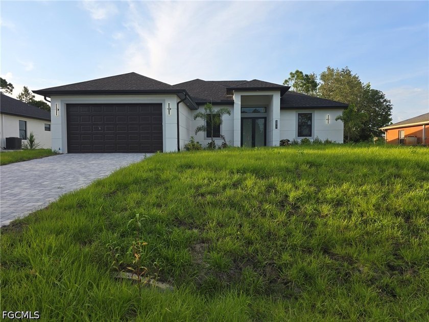 Experience elevated living in this stunning new construction - Beach Home for sale in Lehigh Acres, Florida on Beachhouse.com
