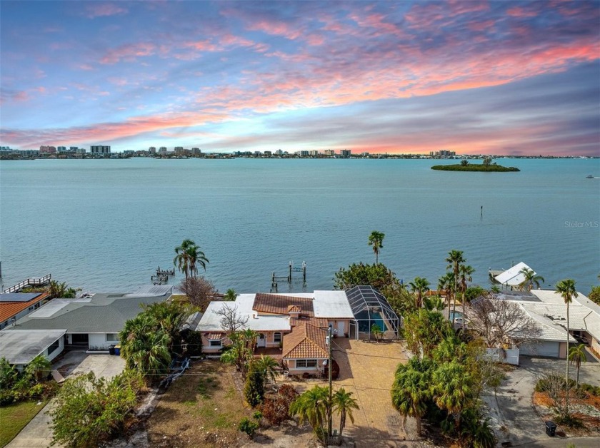 This STUNNING Waterfront Property, perfectly situated between - Beach Home for sale in Clearwater, Florida on Beachhouse.com