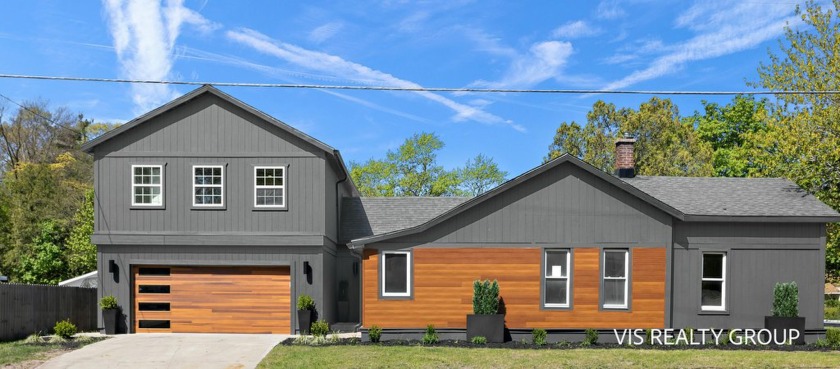 Discover this stunning 5-bedroom, 3-bathroom home in the village - Beach Home for sale in Spring Lake, Michigan on Beachhouse.com
