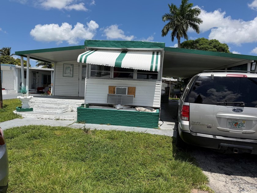 Nice 2/1 with carport - shed - on Canal - -tile floors through - Beach Home for sale in Davie, Florida on Beachhouse.com