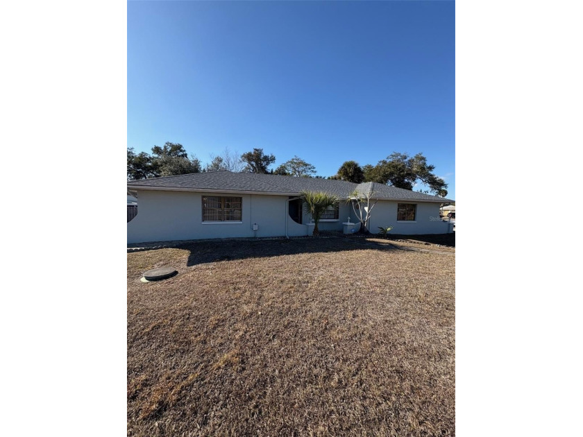 Beautifully maintained three-bedroom, two-bath home situated on - Beach Home for sale in Port Charlotte, Florida on Beachhouse.com