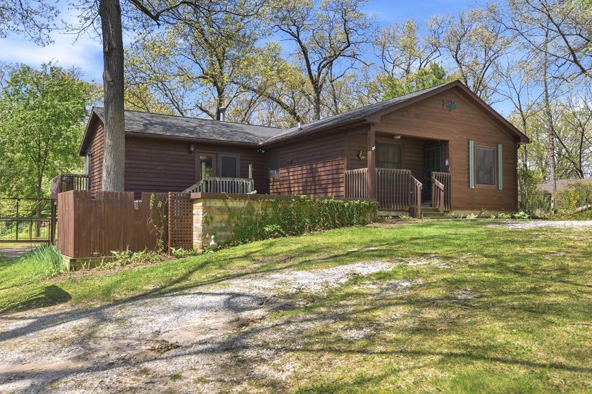 Tucked away in quiet neighborhood, this recently-updated home - Beach Home for sale in New Buffalo, Michigan on Beachhouse.com