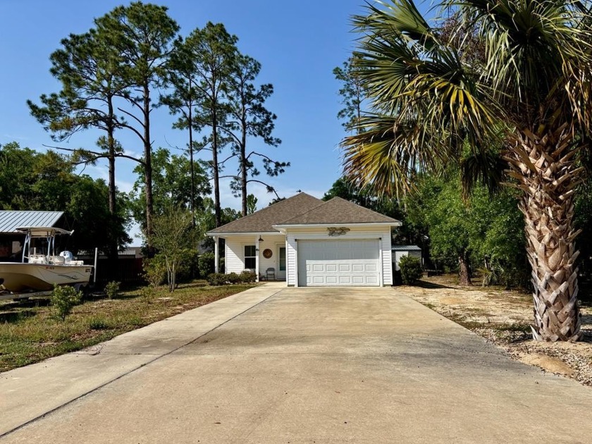 Welcome to this charming 3-bedroom, 2-bathroom home tucked away - Beach Home for sale in Port St Joe, Florida on Beachhouse.com
