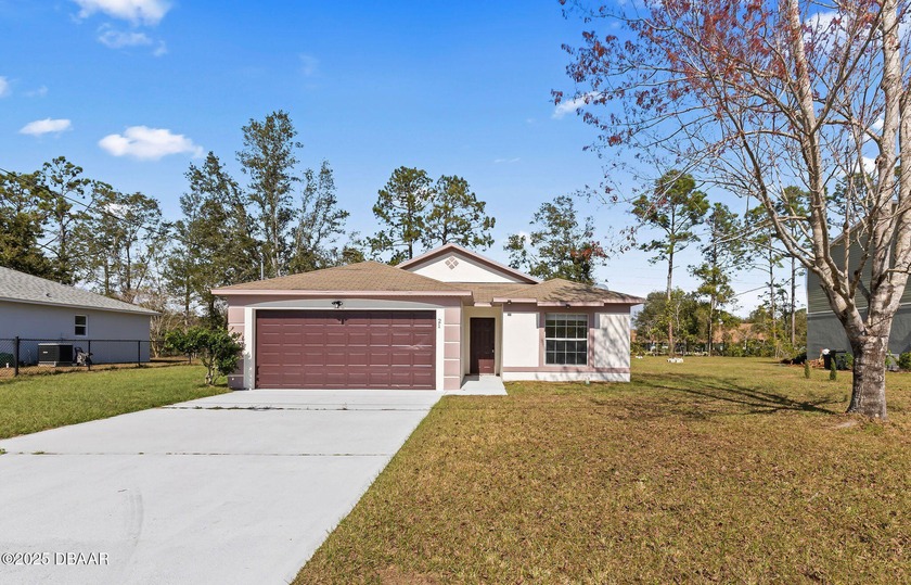 This beautifully remodeled 4-bedroom, 2-bath, 2-car garage home - Beach Home for sale in Palm Coast, Florida on Beachhouse.com