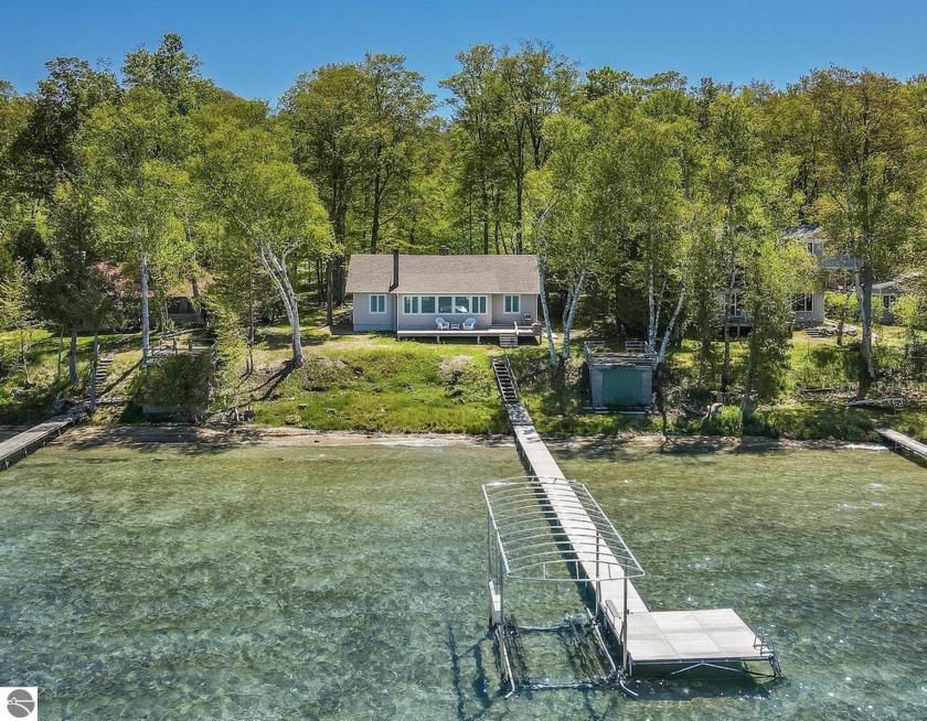 Rare opportunity to own a home on Big Glen Lake. This 1930s - Beach Home for sale in Maple City, Michigan on Beachhouse.com