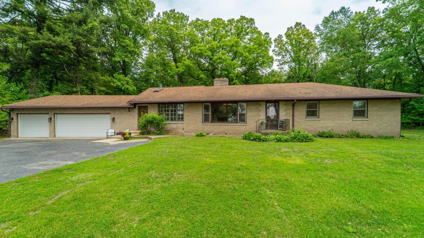 Nestled back from the road and surrounded by mature trees and - Beach Home for sale in Chesterton, Indiana on Beachhouse.com