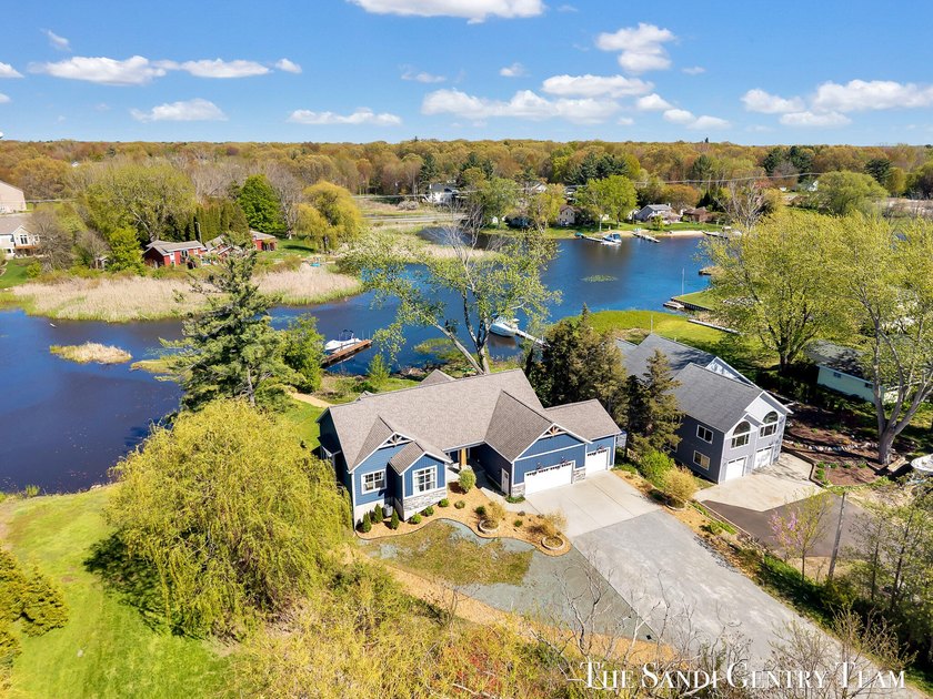 Experience the perfect lakeside newer walkout Ranch Home with - Beach Home for sale in Spring Lake, Michigan on Beachhouse.com