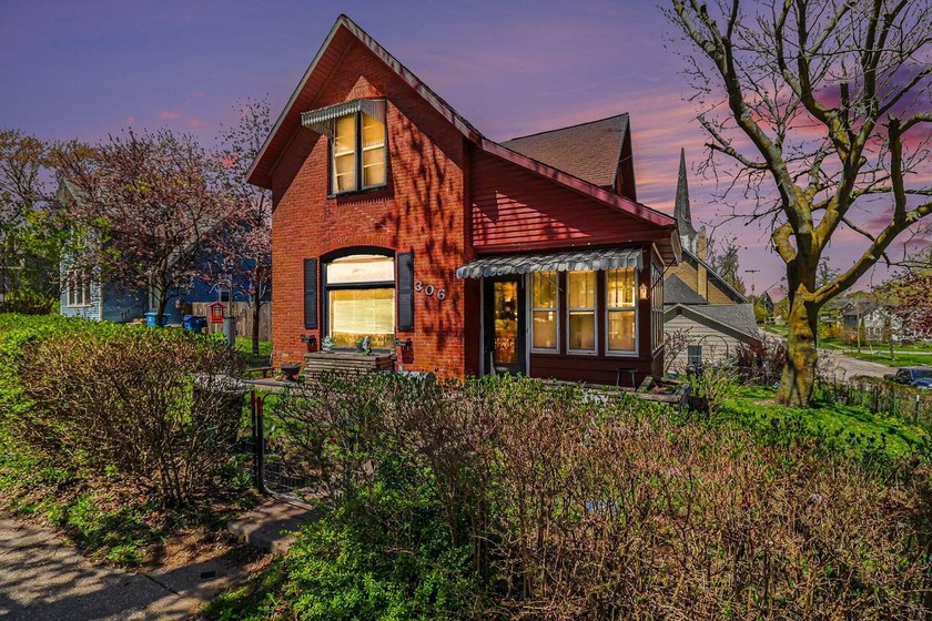 Welcome home! 306 5th Street in Manistee is a charming brick - Beach Home for sale in Manistee, Michigan on Beachhouse.com