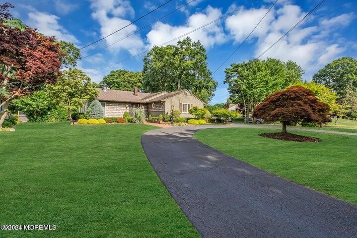 PRICE REDUCED!!! Convenient circular driveway takes you to the - Beach Home for sale in Oakhurst, New Jersey on Beachhouse.com