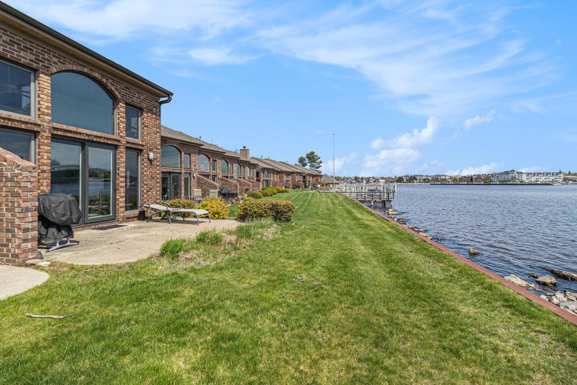 Escape to waterfront luxury with this exceptional waterfront - Beach Condo for sale in Ludington, Michigan on Beachhouse.com
