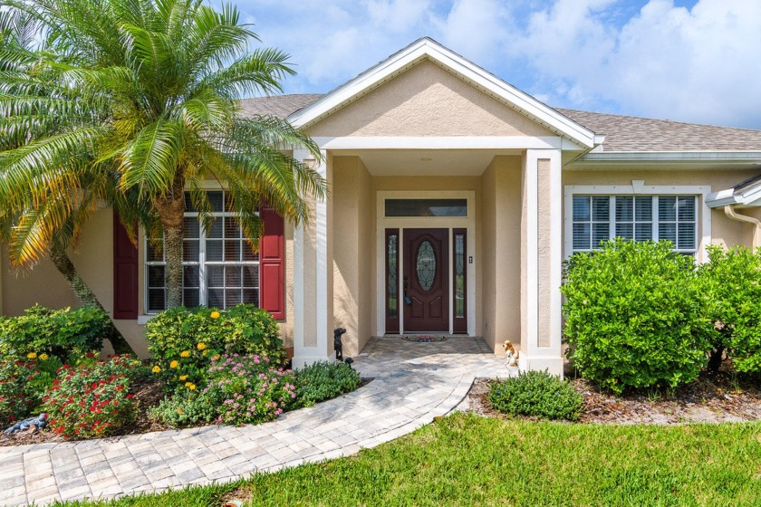 This charming 4-bedroom, 2-bathroom, 2-car garage home with a - Beach Home for sale in Merritt Island, Florida on Beachhouse.com